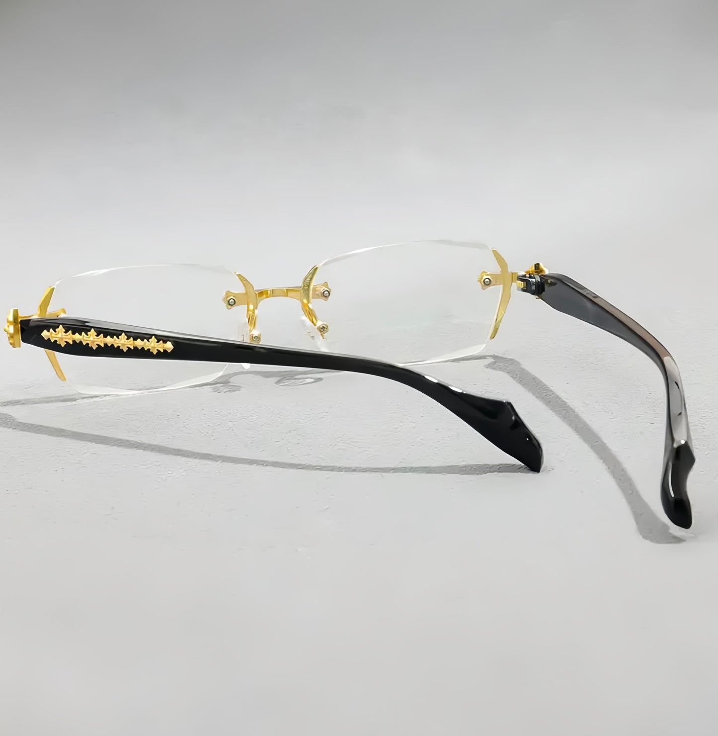 Iz Refined Elegance: Vintage-Inspired Rimless Eyewear Frame with minimalist Gold Design.